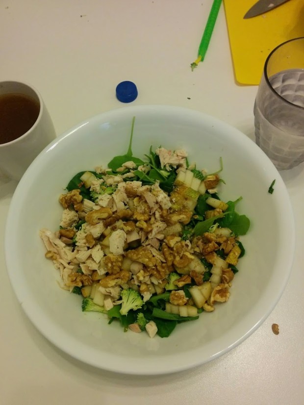 Sweet salad with chicken, greens, broccoli, pears, walnuts, and balsamic vinaigrette.  And that's not tea, it's a cup of broth.